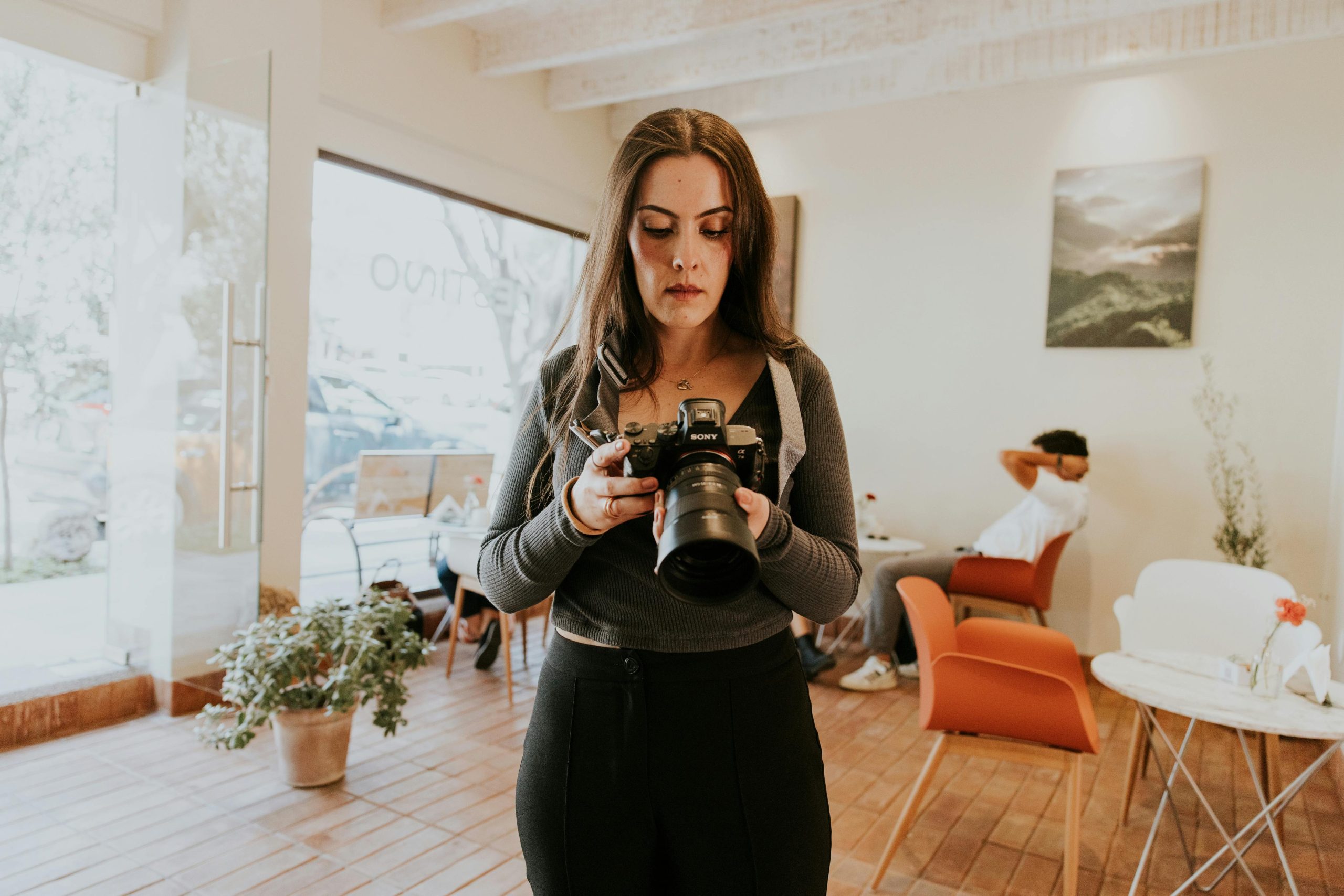 Photographer at Work in Cozy Cafe Setting